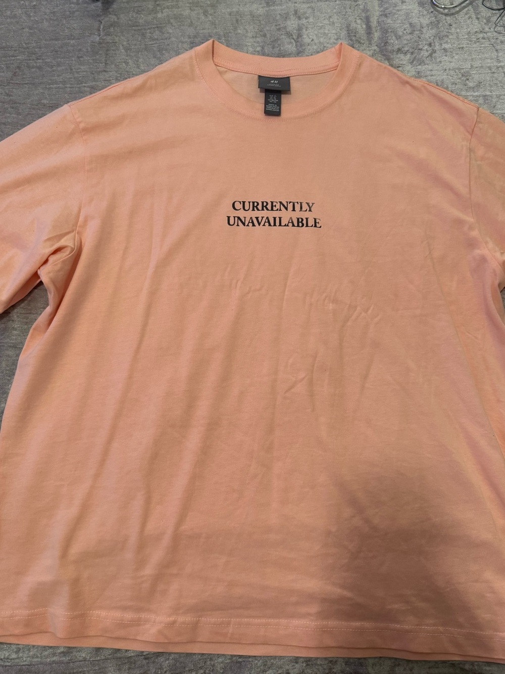 H&M Peach Short-Sleeve Tee with "CURRENTLY UNAVAILABLE" Graphic